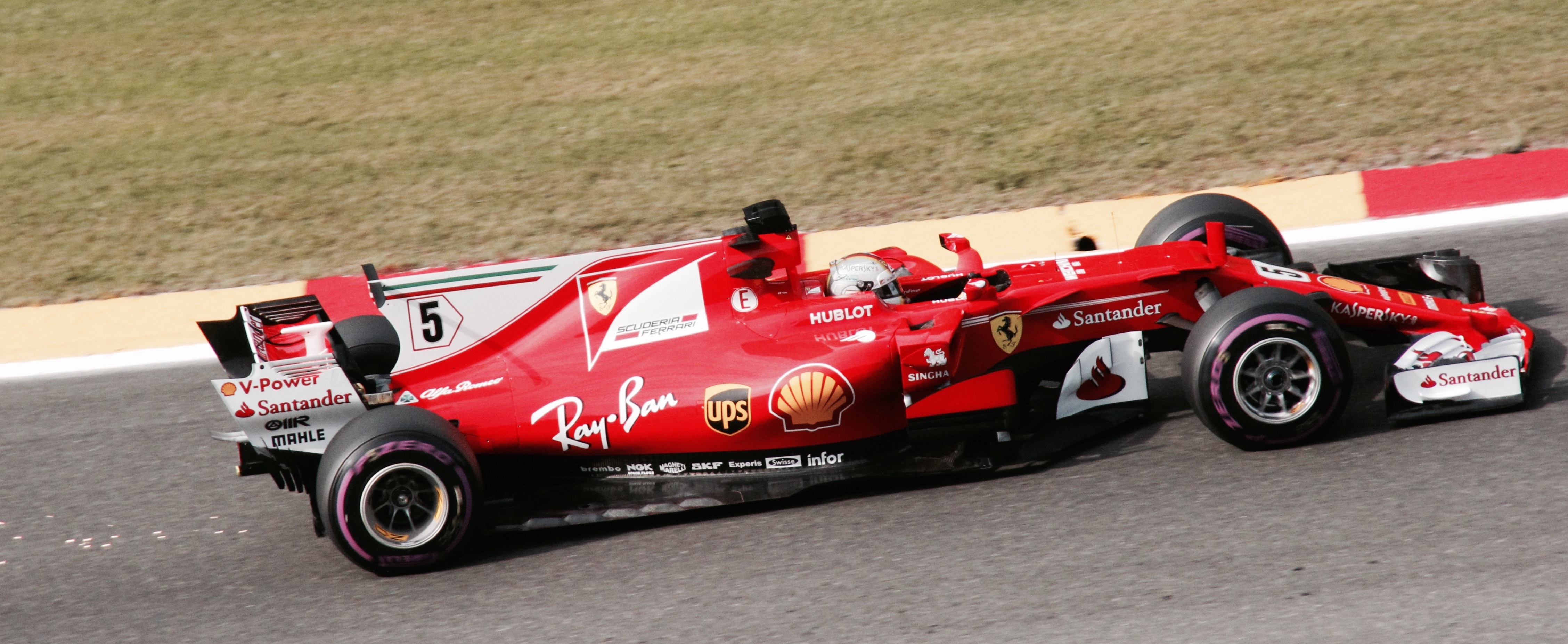 Figure 1: Sebastian Vettel on his Ferrari (Photo by Sven Brandsma on Unsplash)